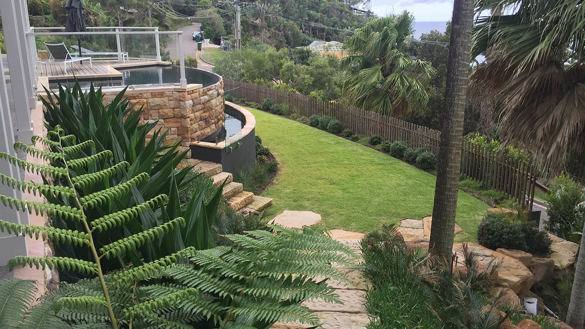 Garden and landscaping view with freshwater infinity pool and stonework