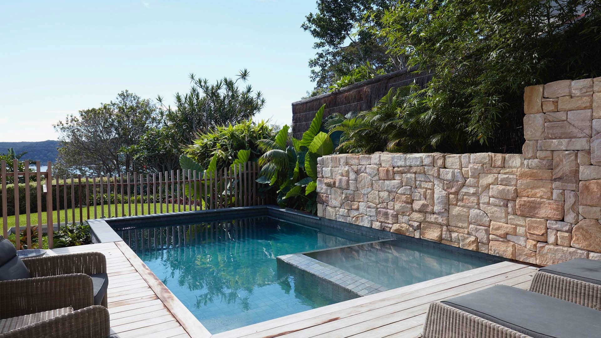 Angled view, from the house, of full Pool and spa towards the garden and ocean.